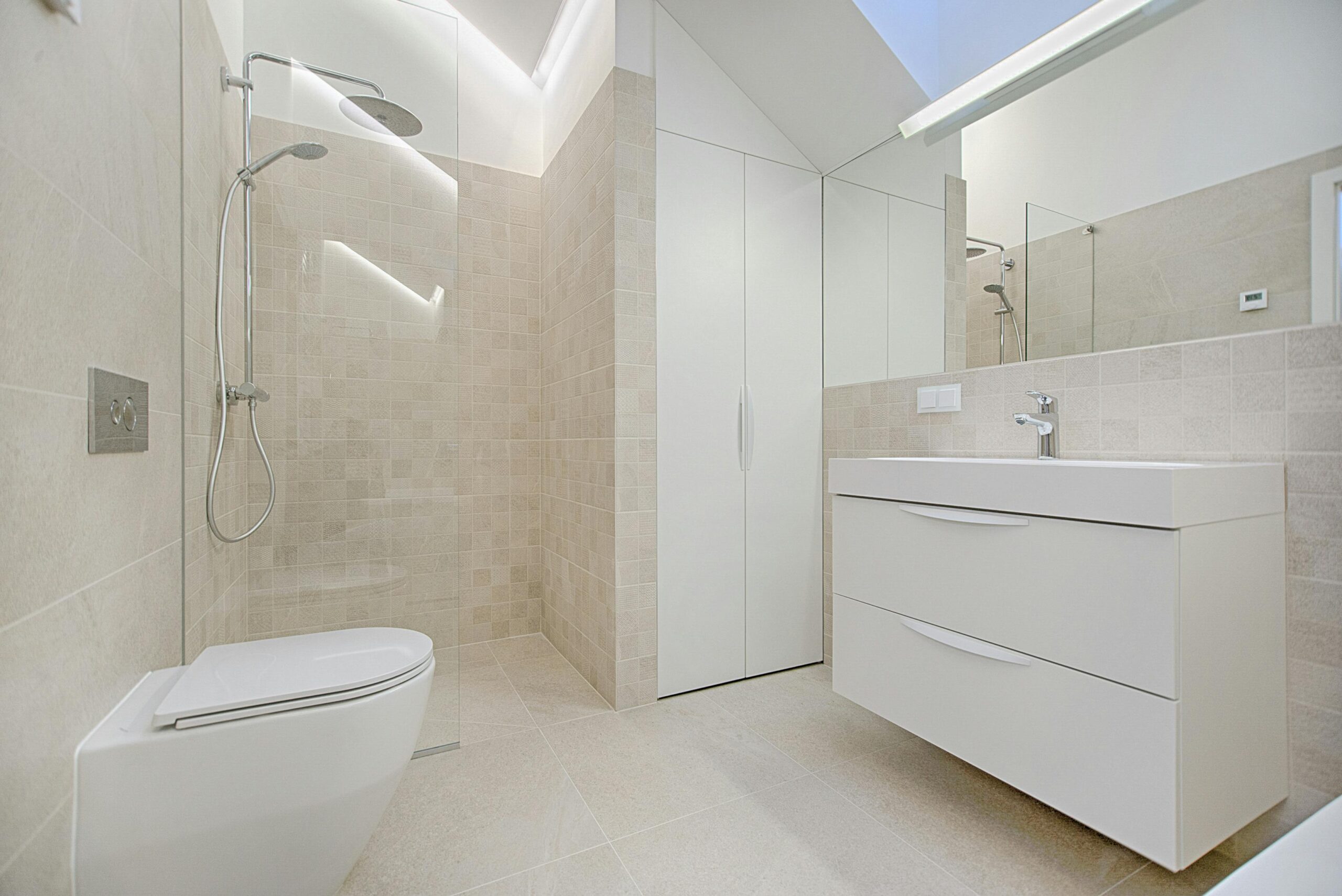 Elegant Modern Bathroom with Sleek White Fixtures and Beige Tiles in Macomb