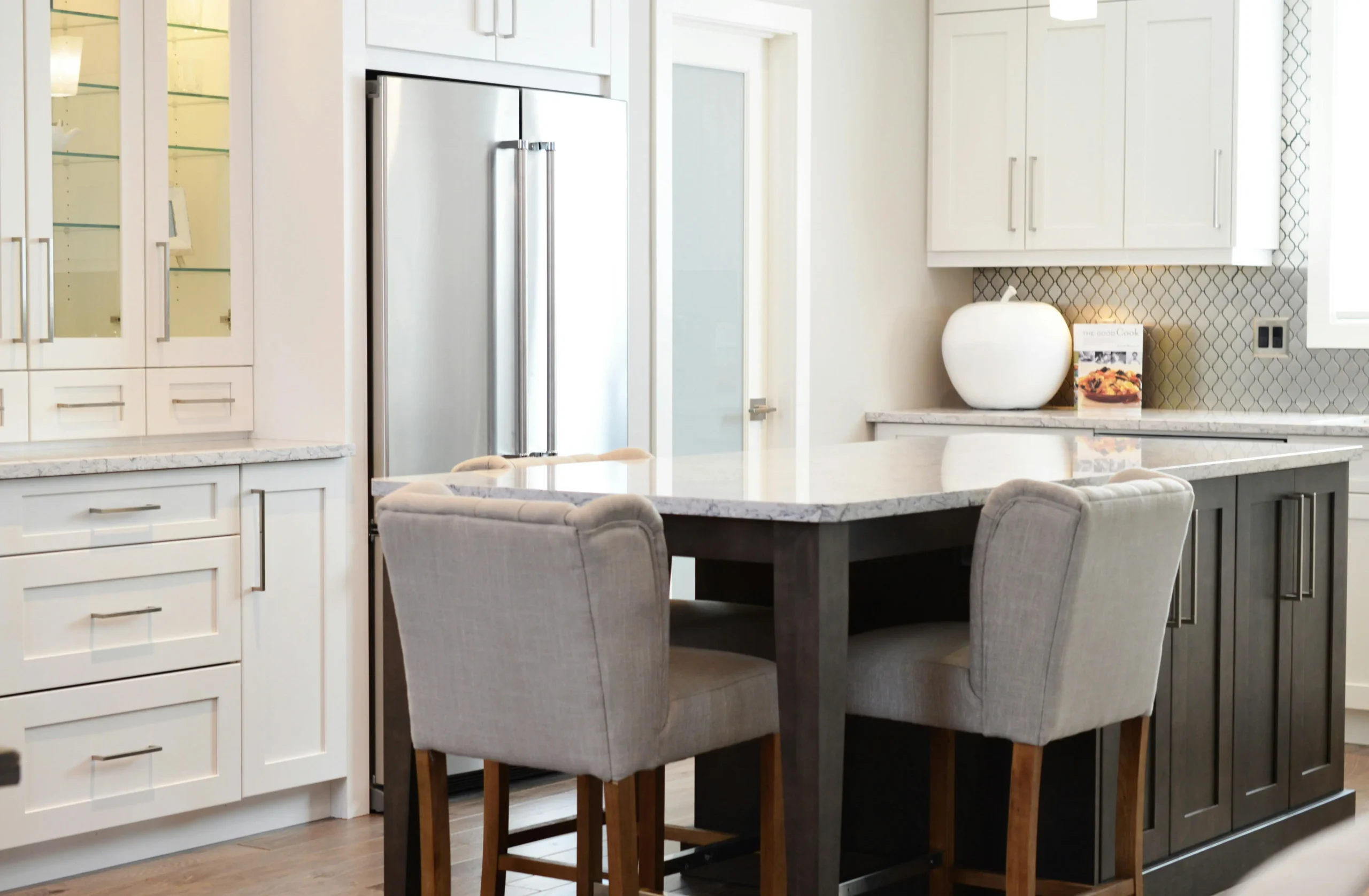 Modern kitchen design with sleek appliances and stylish seating in Columbus.