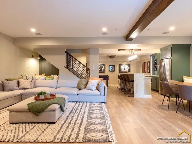 Finished basement with modern sofa, TV, and storage solutions in Oxford City.