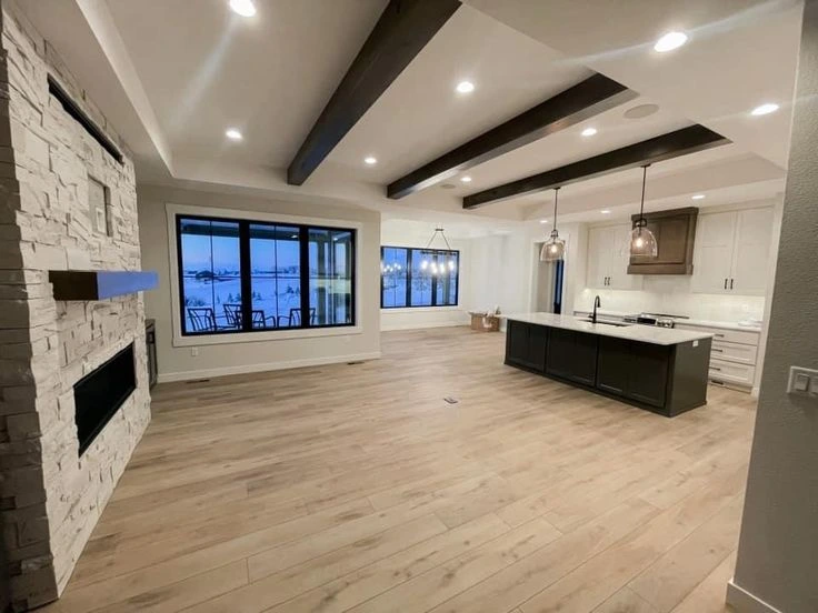 Basement remodel with bright walls and open floor plan in Warren City.