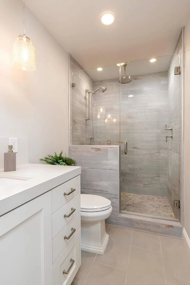 Bright bathroom remodel featuring vanity and walk-in shower in Novi City.